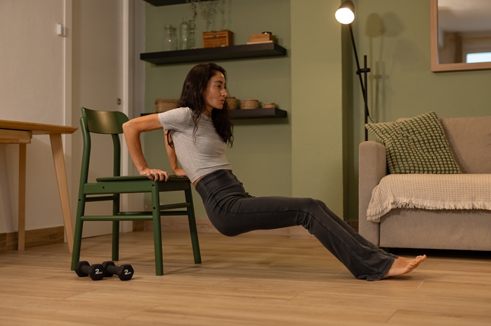 woman using chair instead of a weight bench
