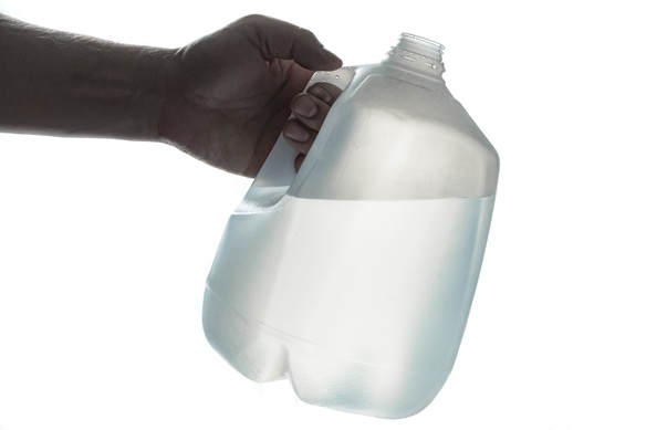 gallon jug of water being used as a weight