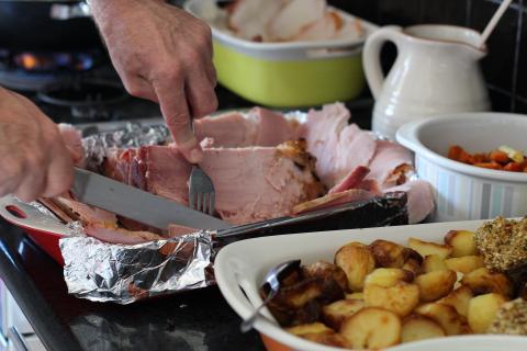 Ham, potatoes and side dishes in a buffet-style service.