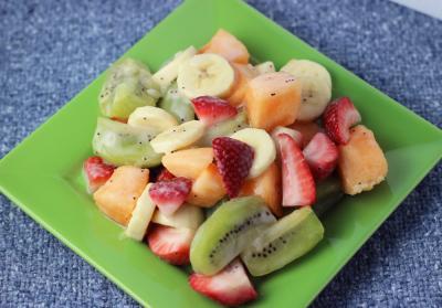 melon berry fruit salad on a green plate