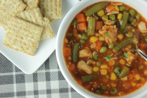 quick vegetable soup in a bowl with crackers on the side