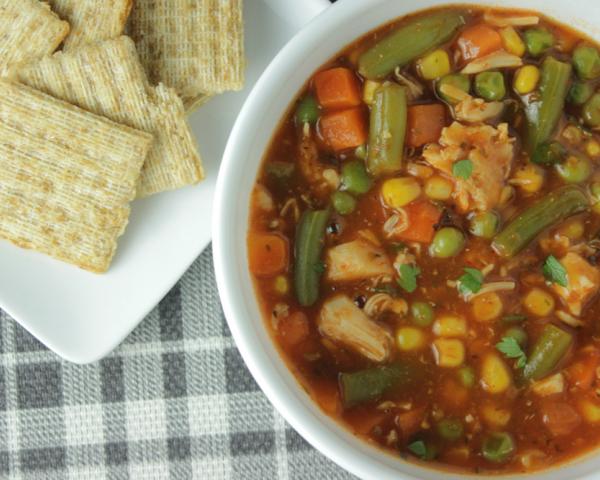 quick vegetable soup in a bowl with crackers on the side