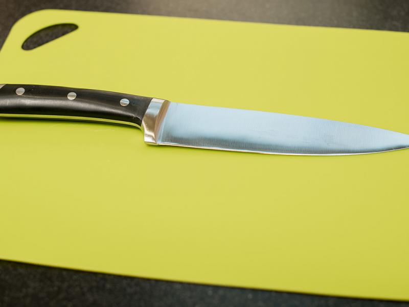 chef knife on cutting board