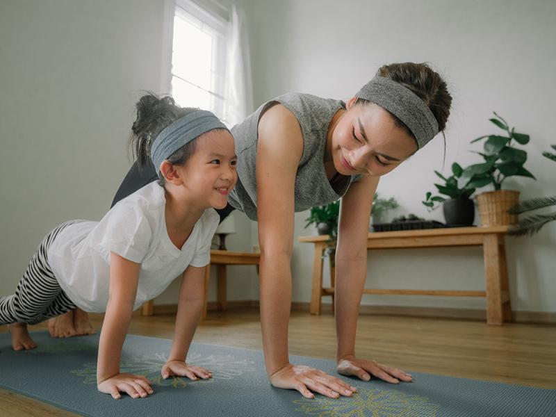 mom and daughter doing pushups