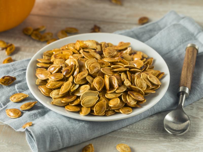 white round plate with pumpkin seeds on top