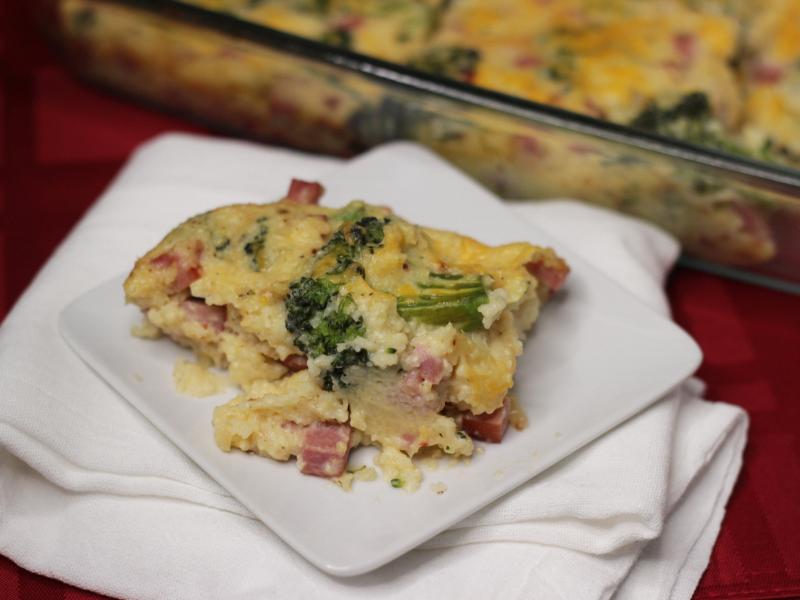 country ham and broccoli casserole serving on a small white plate