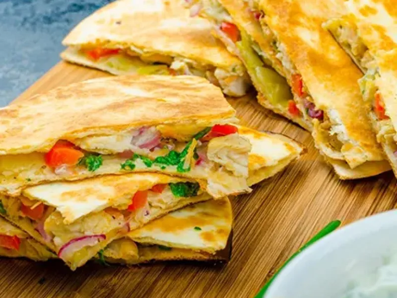 Chicken quesadilla on a cutting board