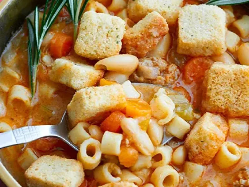 Bowl of pasta fagioli with croutons