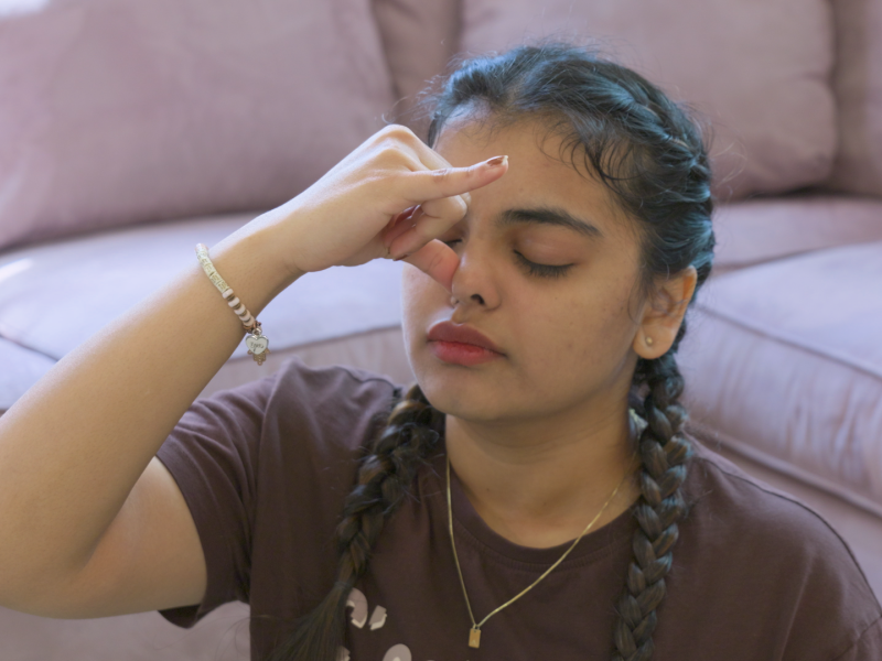 woman doing alternate nostril breathing