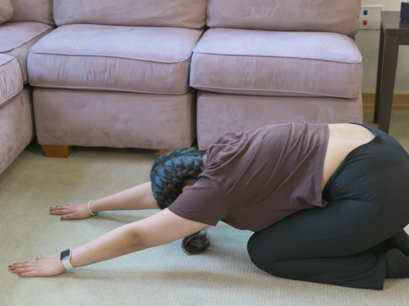 woman doing child's pose