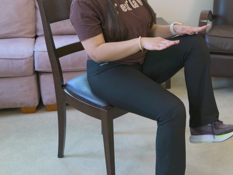 woman doing seated march