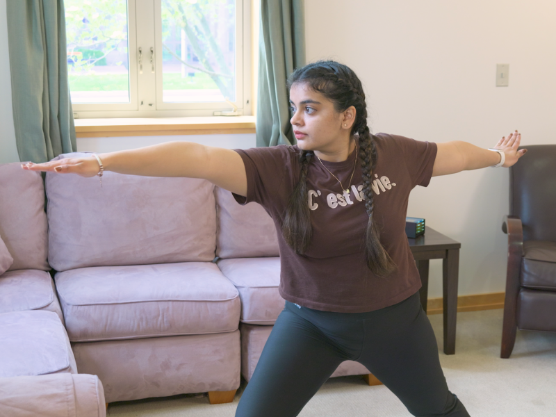 woman doing warrior two pose