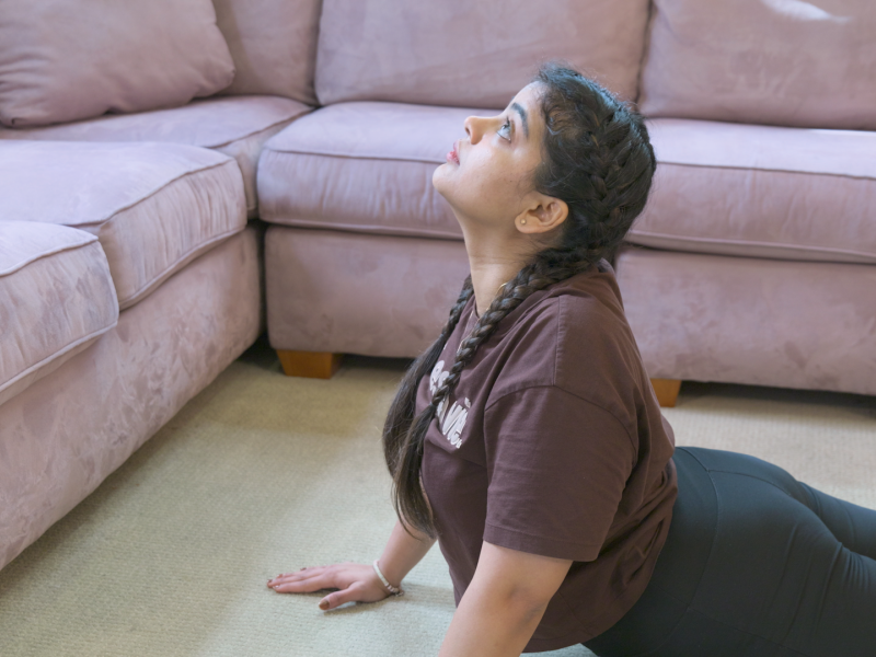 woman doing cobra pose