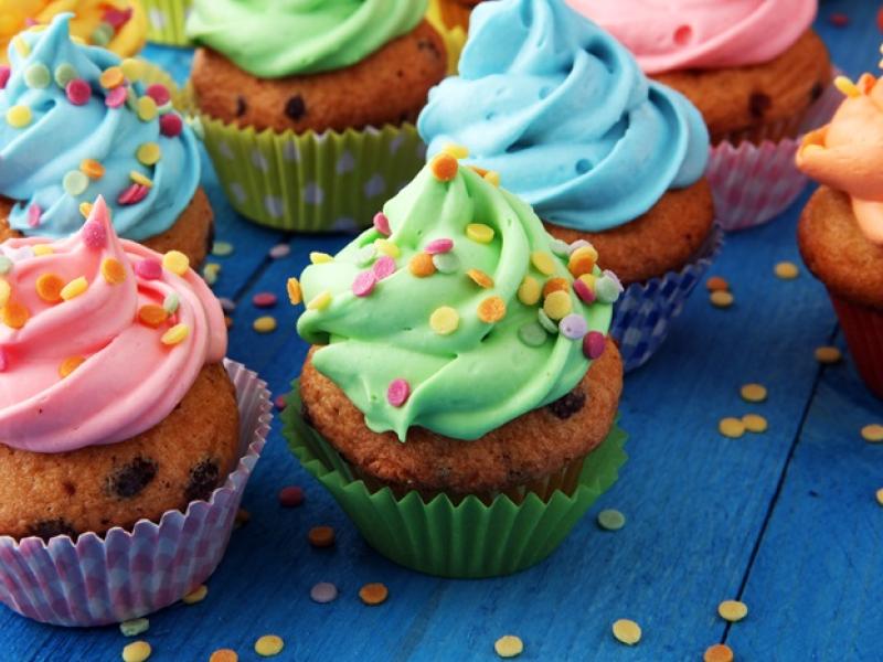 cupcakes decorated with sprinkles and icing