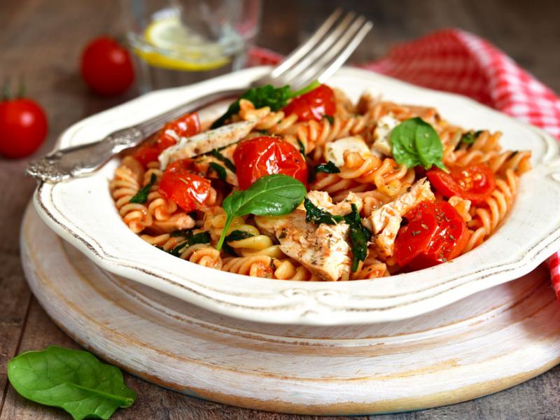 Chicken Florentine pasta in a white bowl