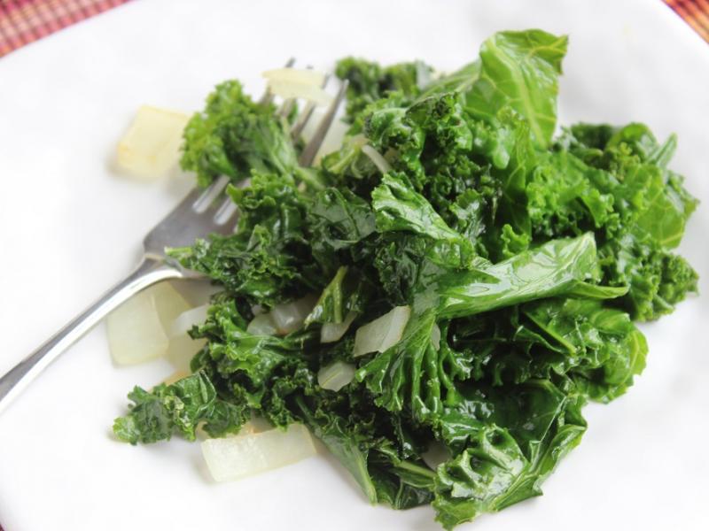 sauteed kale on a white plate