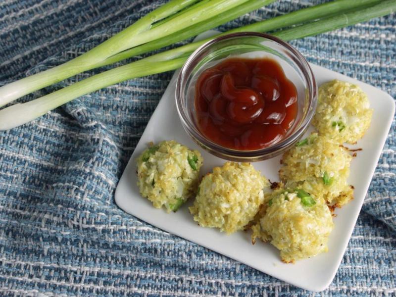 five Veggie Tots on a white plate served with ketchup