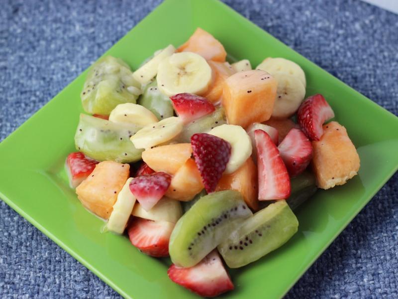 melon berry fruit salad on a green plate