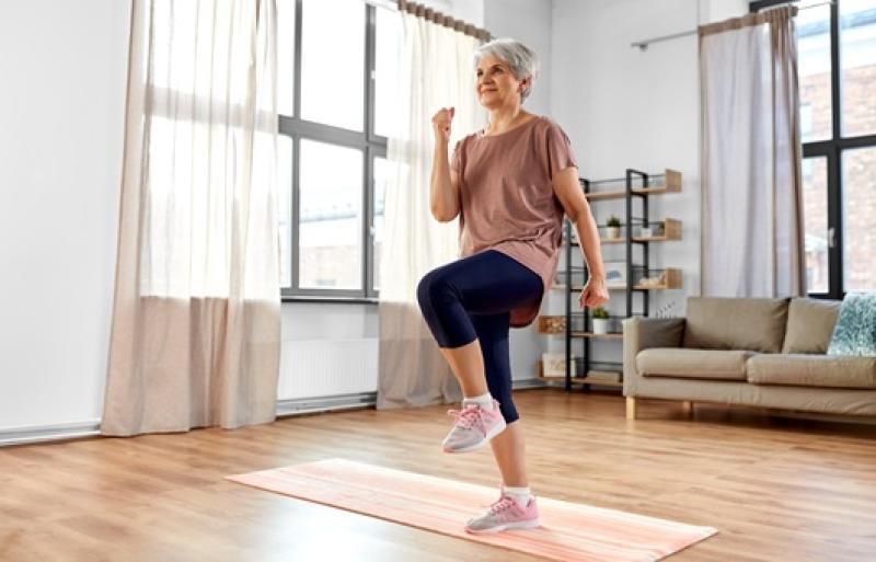 woman walking in place in her living room